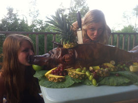 Girls kissing pig